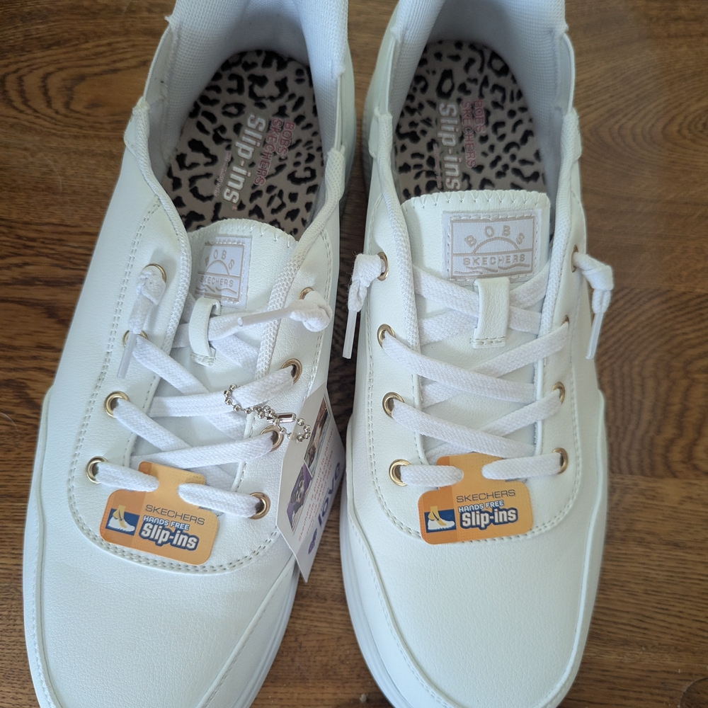 Skechers Women's White Slip-Ins with Gold Accents